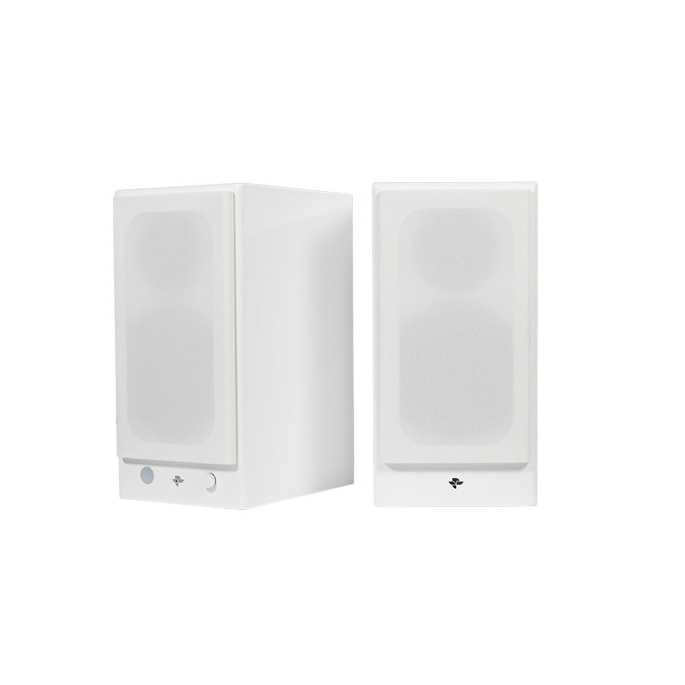 The white Kin Play pair with the magnetic grilles fitted, hiding the drivers behind a plain cloth front