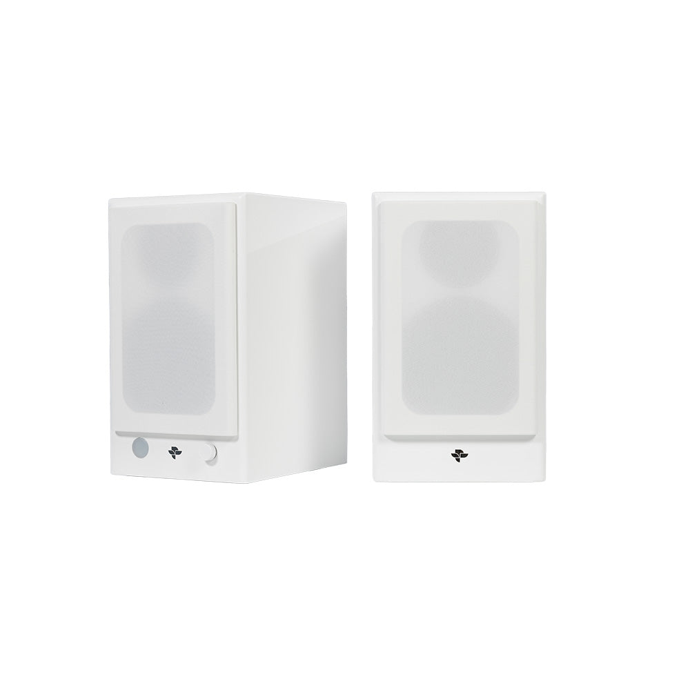 The white Kin Play Mini pair with the magnetic grilles fitted, showing the plain cloth fronts
