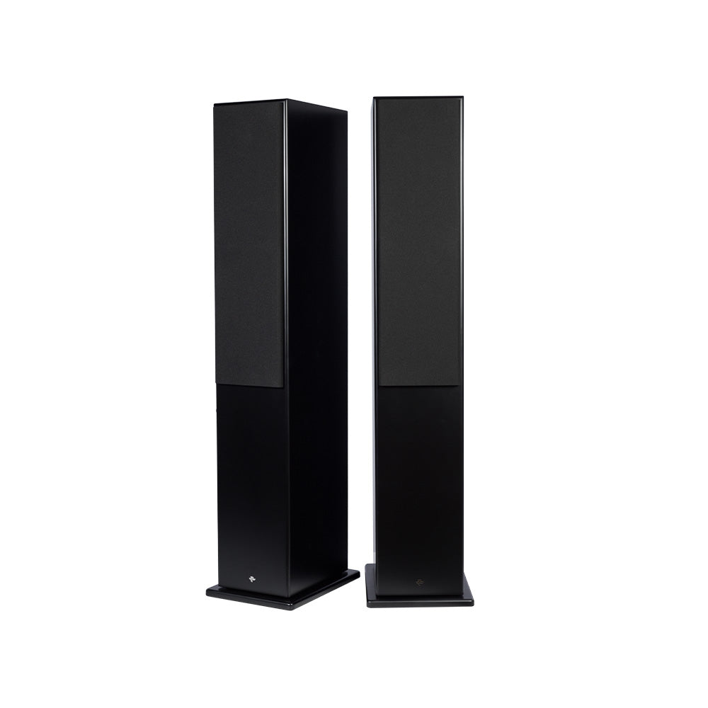The black Tower II pair with the magnetic grilles fitted, standing on their bases as two plain slim columns
