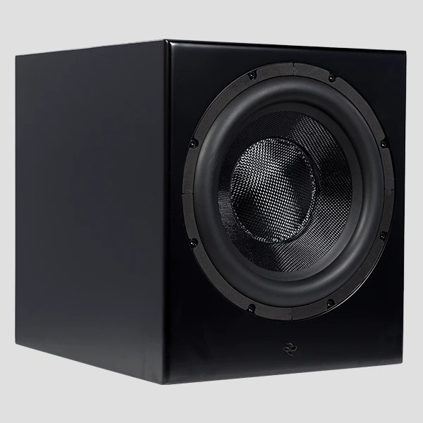 The Kin Sub 10 in satin black from the front left, grille off, showing the ten-inch woven-fibreglass cone and its anodised dust cap in a sealed cabinet